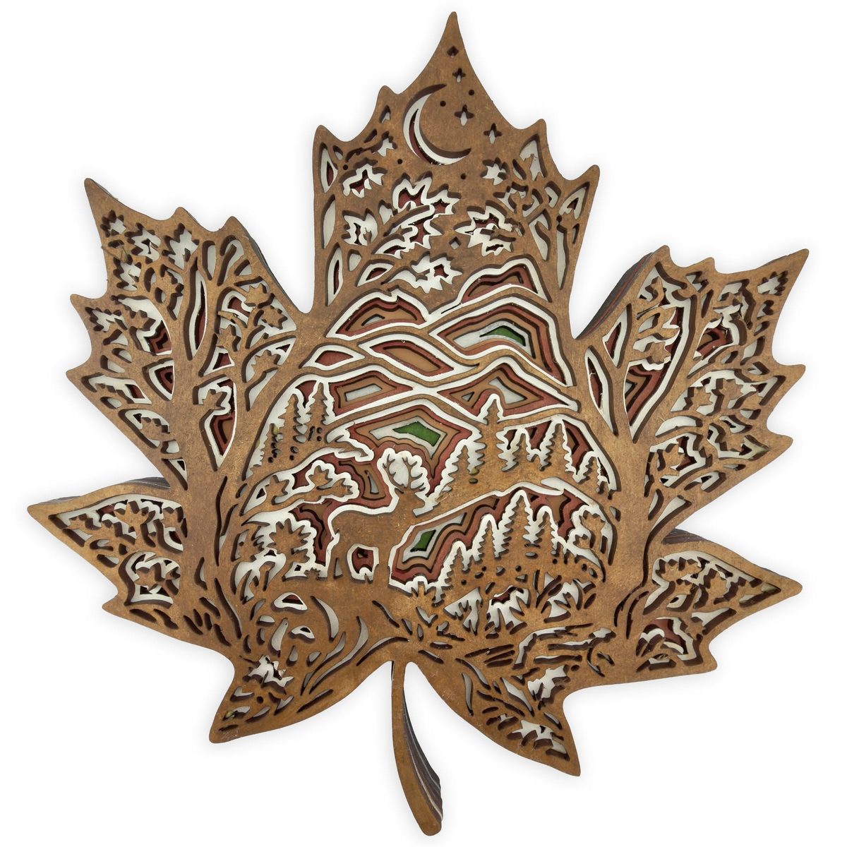 A maple-leaf-shaped layered piece in natural wood, holding a scene of pine trees and hills under a crescent moon.